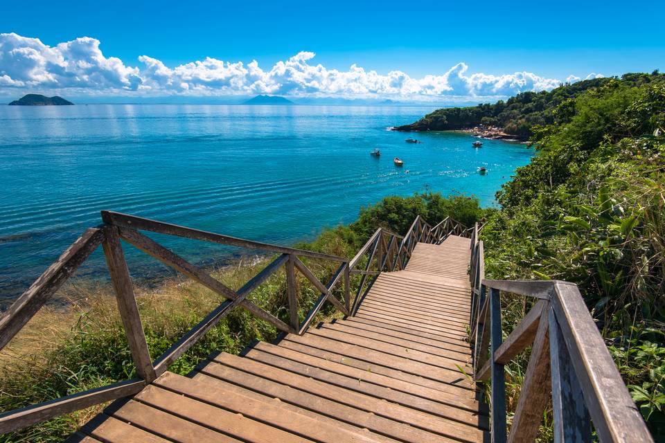 A turquoise cove and boardwalk in Buzios