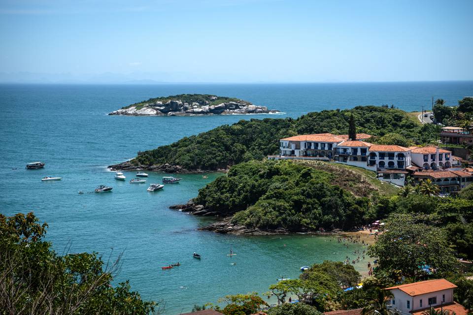 A colonial headland above clear water